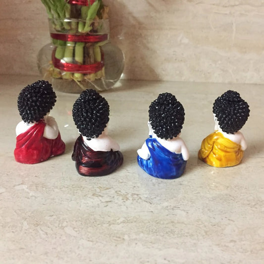 ACXSerene Multicolor 4 Baby Monks Buddha Figurines - for Car Dashboard | Home Decor| Office Decor| Chrismas Decor| Diwali Decor| Vaastu Decor| Fengshui Decorative Showpiece Decorative Showpiece  -  2 cm (Polyresin, Multicolor)